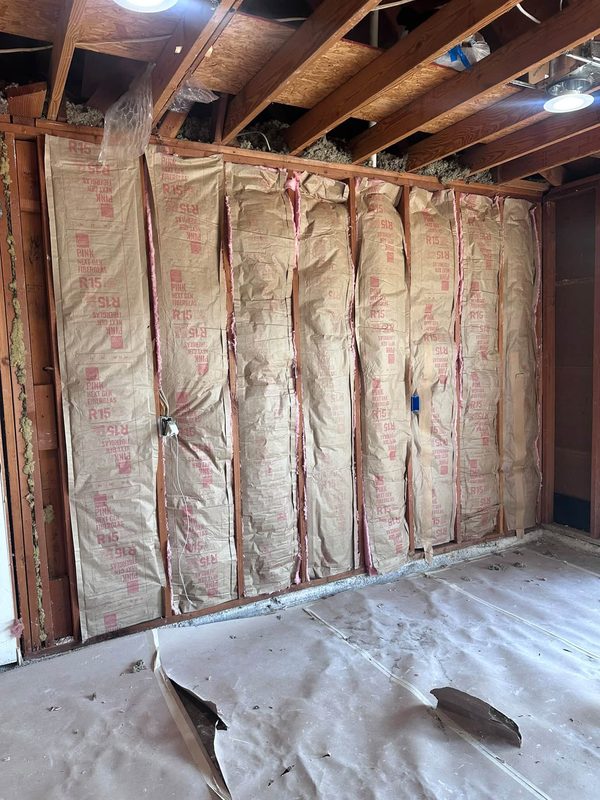 New batt insulation in the wall cavities before drywall