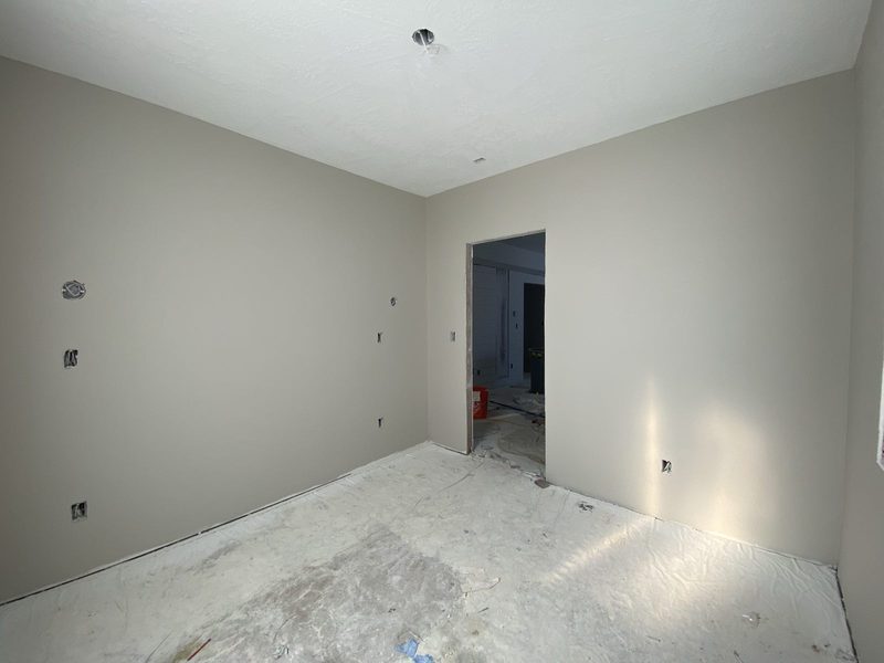 Painted room with the doorway opened to the hall
